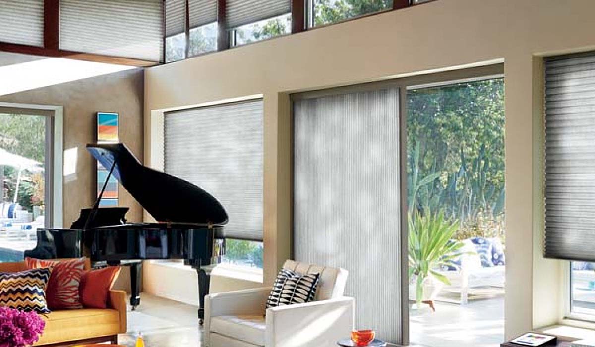 Duette honeycomb shades covering tall windows