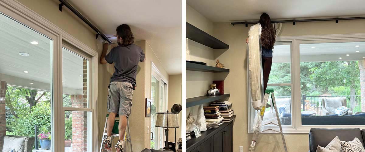 A professional installing custom draperies in a home