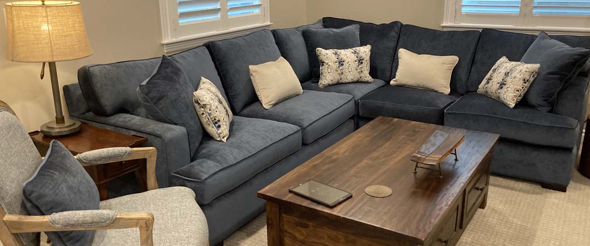 A newly upholstered sofa in a styled living room